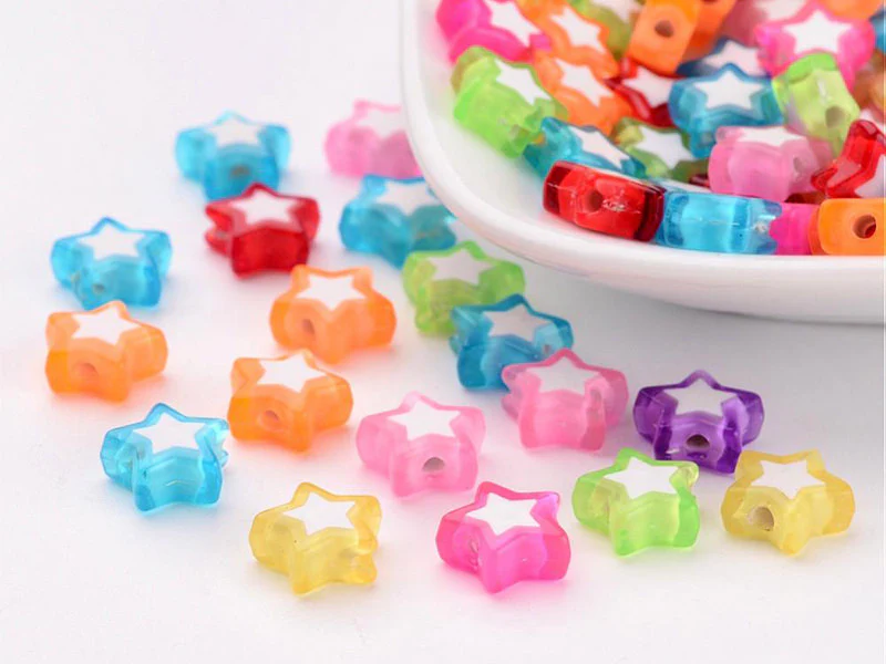 50 perles en plastique étoiles - transparent et blanc - 9x10 mm - Image 2
