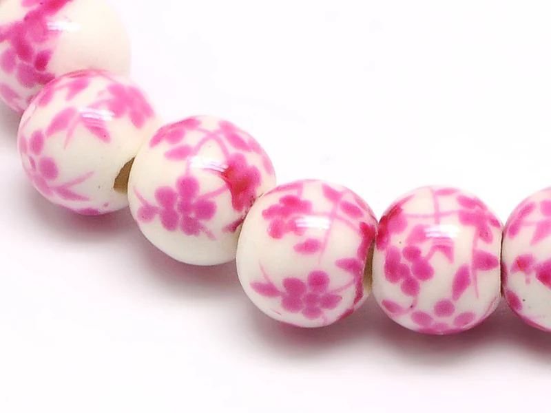 Lot de 10 perles en porcelaine - fleurs roses - 6 mm