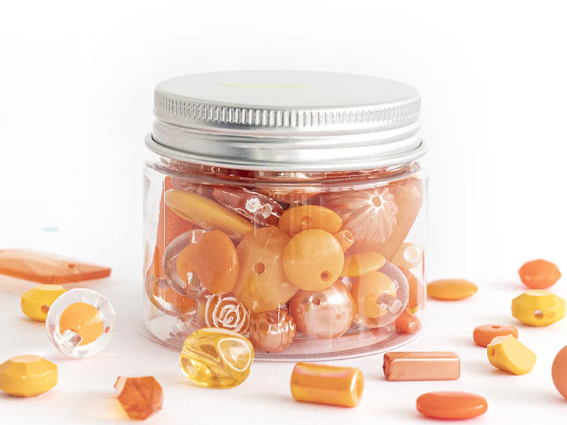 Pot de perles en plastique - nuances d'orange